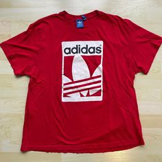 "Adidas Originals Men's T-Shirt with Back Graphic Material: Cotton Condition: Great condition (see images) Size on Tag: Extra Large (XL) Fits Like: Large (L) --------------------------------------------------- Measurements: Length: 26 inches (66 cm) Pit-to-Pit: 21.5 inches (54.6 cm) Sleeve (Shoulder-Cuff): 7 inches (17.8 cm) Length represents \"front length\" - measure from the highest point of the shoulder to bottom of garment. --------------------------------------------------- Shipping: Worldwide shipping available. Combined shipping available, please contact for price quote. Returns/exchanges are accepted within a 30-day period. Buyer is responsible for return postage costs and any loss in value if an item isn't returned in original condition. Refunds will not be issued for Return to S Adidas Graphic Tee For Streetwear, Adidas Logo Cotton Casual T-shirt, Casual Adidas Logo Cotton T-shirt, Vintage Tommy Hilfiger Jackets, 80s Sportswear, Vintage Nike Windbreaker, Diamond Wallpaper, Graphic Material, Adidas Windbreaker