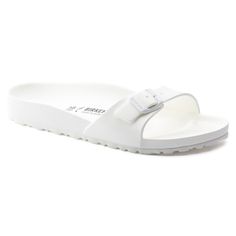 Madrid Essentials White Lightweight Slip-on Sandals, Lightweight White Slip-on Slides, White Slip-on Jelly Sandals For Beach, Summer Jelly Sandals With Adjustable Strap, Summer Synthetic Jelly Sandals With Adjustable Strap, Adjustable Synthetic Flip Flops With Buckle Closure, Summer Travel Slip-on Sandals, Adjustable Cushioned Sandals For Travel, White Open Toe Flip Flops For Outdoor