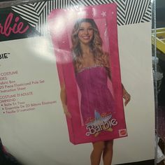 a barbie doll in a pink dress is on the back of a package for sale