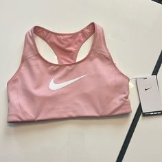 Nike Training Sports Bra - Light Pink - Size S Nwt Spring Athleisure Activewear For Sports Events, Nike Racerback Activewear For Light Sports, Spring Athleisure Sports Bra For Sports Events, Medium Support Sports Bra For Spring, Nike Sporty Activewear For Sports Events, Nike Sportswear For Sports Events, Nike Athletic Fit Activewear For Sports Events, Nike Sweat Resistant Sportswear, Spring Racerback Sports Bra