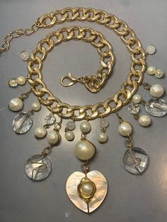 FABULOUS VINTAGE 1980s HEART Pearl Beaded Gold Chain Necklace Large Avantgarde Elegant Glamour Statement Runway Med Gala Designer Couture   Featuring a fabulous necklace of a chunky gold Plated metal With dangly charms of faux pearls and Clear GLASS Beads! This is a very sophisticated and glamorous necklace with a gorgeous design touch! Unsigned but of designer quality for sure! Measurements: 46cm/54cm adjustable, The centre piece has a drop of 8.5cm Condition: In ABOVE excellent vintage conditi Luxury Vintage Beaded Necklaces, Med Gala, Centre Piece, Gold Chain Necklace, Gorgeous Design, Pearl Beads, Amazing Jewelry, Gold Chain, Gold Chains