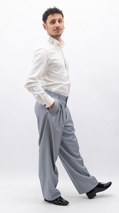 "These tango pants feature a standard waistline, sitting at or slightly below the natural waist. They offer a more conventional fit compared to high-waist designs. Fabric Choices: Similar to high-waist tango pants, they're crafted from quality materials such as cotton, polyester, and lycra providing flexibility and comfort for dance movements. Details: These pants may have 3 pleats and has a discreet embellishment, letter 'C',  near the pockets,which is associated with \"Chique\" could represent the brand's monogram. It is elegantly incorporated into the design, showcasing the brand's identity and reinforcing its presence in the fashion market.adding a touch of style without being too flashy. Color and Style: Available in various colors, they range from classic black, navy, and gray to mor Classic Slim Fit Wide Leg Pants, Classic Wide Leg Slim Fit Pants, Semi-formal Slim Fit Full-length Bottoms, Slim Fit Full Length Bottoms For Semi-formal Occasions, Elegant Tailored Bottoms With Hip Pockets, Slim Fit Wide Leg Bottoms For Business Casual, Modern Formal Long Pants, Modern Formal Long Bottoms, Casual Tapered Leg Pants For Tailoring