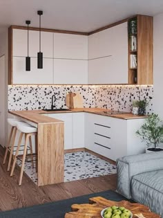 the kitchen is clean and ready to be used as a living room or dining area