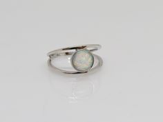 Vintage Sterling Silver White Opal Ring ...Marked 925...Total of weights 2.2grams...Size 7...Measure of stone center 10.2MM...It's in very good condition. A Nickel-free Opal Silver Ring, Silver Opal Ring With Round Stone, Silver Opal Jewelry With Round Stone, Stackable Silver Opal Jewelry, Adjustable Silver Opal Promise Ring, Adjustable White Gold Opal Birthstone Ring, Nickel-free Adjustable Opal Rings, Adjustable Nickel-free Silver Opal Ring, Sterling Silver Opal Ring With Round Band