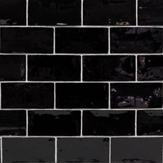 a black brick wall with white grouting