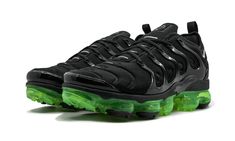 The Air VaporMax Plus isn’t afraid to push the envelope.  The running shoe is a fusion of two iconic styles, with the molded upper of the Air Max Plus placed atop VaporMax cushioning.  For this colorway, the Air VaporMax Plus comes with a sleek combination of black, reflective silver, and volt green.  What stands out the most is the radically reinvented Air cushioning system that glows with the vibrant green color.  The Air VaporMax Plus branding is subtle with small Swooshes and yellow “Vm Air” branding on the heel. Vapormax Plus Black, Air Vapormax Plus, Nike Air Vapormax Plus, Air Vapormax, Air Max Plus, Stadium Goods, Nike Air Vapormax, Vibrant Green, Running Shoe