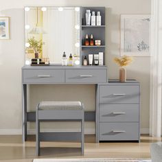 a bedroom with a vanity, stool and mirror