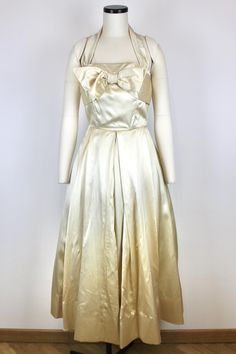 Seductive 1950s Off White Silk Dress No brand or size tags, couture item Origin: Italy Fits like: S Measurements: Bust - 87cm/34,3" Waist - 66cm/26" Displayed on mannequin with the following measurements: Bust 80 cm (31.5) Waist 63 cm (24.8") Hips 91 cm (35.8") Condition: Very Good, there were some light stains on the armpits but we have rearranged the pleats so they are much less noticeable. 1950s Style A-line Vintage Wedding Dress, 1950s Style Dress With Fitted Bodice For Formal Occasions, 1950s Style Dress With Fitted Bodice For Formal Events, Vintage Evening Dress With Lined Bodice, 1950s Style Formal Dress With Fitted Bodice, Vintage Evening Dresses With Lined Bodice, 1950s Style Silk Wedding Dress, 1950s Silk Wedding Dress, Vintage Silk Formal Dresses