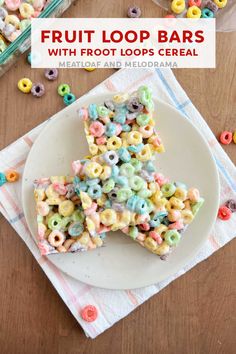 fruit loop bars with froot loops cereal are on a white plate next to a bowl of cereal