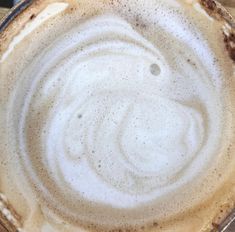 the top view of a coffee cup with liquid in it