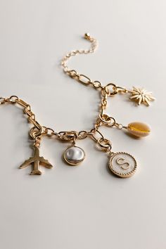 Image shows the Reagan Gold Chain Link Bracelet against a white background. Bracelet has gold circle and oval links. Shown with 5 assorted charms attached. Charm Bracelet Inspiration, Personalized Charm Bracelet, Charm Bar, Gold Chain Link Necklace, Alphabet Charms, Alphabet Jewelry, Charms For Bracelets, Cowgirl Boot, Faux Leather Purse