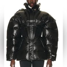 Versace Puffer Jacket Retail: 4325 Self & Lining 1: 100% Polyamide Lining 2: 100% Polyester Fill: 80% Goose Down, 20% Goose Feather Made In Italy Dry Clean Only Front Zip Closure With Snap Button Storm Flap Detachable Hood With Zip Closure Detachable Corset With Zip Closure Side Slant Pockets Interior Zip Pocket Size : 38 Brand New Designer Black Puffer Outerwear, Winter Outerwear With Padded Shoulders, Designer Fitted Puffer Jacket With Padded Collar, Fitted Designer Puffer Jacket With Padded Collar, Fitted Elegant Puffer Outerwear, Designer Fitted Puffer Jacket For Winter, Luxury Fitted Puffer Jacket For Fall, Fitted Luxury Outerwear With Padded Collar, Designer Fitted Puffer Jacket