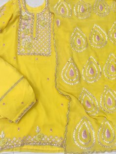 Item Overview ATHARVA Hand Embroidery Custom Stitch Salwar Kameez/Georgette Shirt/Chiffon Gota Patti Dupatta/Embroidery Georgette Salwar/Yellow/Gift/ST521 Dno. ST521 Fabric:  * Shirt: Stitched with Lining/Georgette- Embroidered Neck / 2.5 Mts Beautiful Hand Embroidere Neck * Dupatta: Chiffon Chinnon Dupatta 2.5Mts/Gota Patti Work Border/Lace/Latkans Tassels  * Bottom: Georgette/ Stitched with Lining/Santoon Taffeta/Hand Embroidery/ As per Custom Measurements Excusive Hand Embroidered Party Wear Unstitched Yellow Salwar Kameez With Intricate Embroidery, Fitted Yellow Salwar Kameez With Gota Work, Fitted Yellow Dupatta With Gota Work, Yellow Salwar Kameez With Gota Work, Yellow Semi-stitched Dupatta With Gota Work, Dupatta Embroidery, Georgette Shirt, Patiala Salwar Kameez, Embroidered Suits