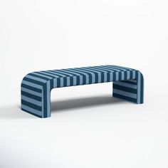 a blue and white bench sitting on top of a white floor