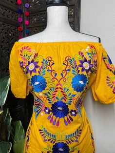 "Beautiful Floral Embroidered Dress - Handmade Embroidered Mexican Dress - Artisan Made Dress Beautiful hand embroidered dress! This has been made and brought directly from Puebla, Mexico. The dress has extremely detailed embroidery. The embroidery is 100% handcrafted. All the work on this dress has a professional skilled finish and the multicolor embroidered makes it look even more eye catching. The embroidery work is made with great quality thread. The eye catching will be on the embroidered w Folk Style Multicolor Embroidered Dress, Peasant Style Embroidered Dress For Festival, Peasant-style Embroidered Dress For Festival, Festive Yellow Embroidered Dress With Floral Details, Folk Style Floral Embroidered Dress For Festivals, Folk Dress With Geometric Embroidery For Festivals, Folk Style Dress With Geometric Embroidery For Festivals, Traditional Spring Embroidered Dress, Folk Style Embroidered Dress With Multicolor Embroidery