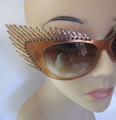 "Stunning Mardi Gras style vintage fantasy eyewear sunglasses. Handcrafted beauties like this are rare and highly collectible, one of a kind, hand painted. Coppery brown frames, carved eyelashes and smoked plastic lens. Art Deco feathers fan out into winged cat eye. Sparklies and clear faceted rhinestones dot eyelashes. Mikli Paris Hand Made in France #029633/ Lens measures 2-1/2\"/6.5cm x 1-1/2\"/4cm , temple 5-1/4\"/13.5cm, total width of glasses 9-1/4\"/23-1/2cm, total height 3\"/7-1/2cm. Con