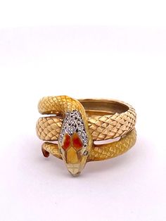 This Masriera Enamel Snake ring is very special.  Masriera is known for there Enamel and Plique a Jour pieces.  This is designed in the Art Nouveau revival style.  This ring features a textured body that resemble snake scales and is done in a highly polished enamel.  There is a bit of enamel loss not really noticeable on the head but otherwise it is special. The enamel is done in pale tones of yellow and orange with 13 bead set single cut Diamonds weighing .070 carats.  The ring also has a bit o Art Nouveau Revival, Plique A Jour, Snake Scales, Serpent Jewelry, Lapis Lazuli Jewelry, David Webb, Snake Jewelry, Snake Bracelet, Animal Rings