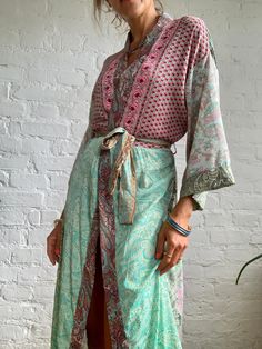 "This is patchwork style robe, with wrap tie closure feels very light and comfy as a daily cover up around the house or outside paired with jeans  Loose and silky, with wide kimono sleeves MEAESURE one size fits most  length 55\" MATERIAL *polyester Please visit also  https://www.etsy.com/shop/AltheaStores For more ideas Thank You for looking" Bohemian Spring Kimono With Tie Waist, Green Wrap Kimono With Tie Waist, Pink Bohemian V-neck Kimono, Bohemian V-neck Festival Robe, Hippie Wrap Kimono For Beach Cover-up, Green Bohemian Robe With Kimono Sleeves, Spring Hippie Wrap Kaftan, Bohemian Robe With Kimono Sleeves In Green, Hippie Wrap Kaftan For Spring