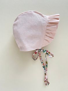 "ruffled floral baby bonnet girl / reversible ruffle bonnet / baby sunbonnet / baby sun hat / rifle paper co baby bonnet Made to Order This reversible ruffle bonnet is made from 100% cotton Rifle Paper Co floral fabric. It is lined with a peachy pink linen blend and has a sweet ruffle to frame your baby's face. You can also check out our Ready to Ship section for bonnets that ship in 1-2 business days https://www.etsy.com/shop/willowandhazel?ref=seller-platform-mcnav&section_id=17440954 Due Cute Pink Cotton Bonnet, Fitted Summer Bonnet With Curved Brim, Fitted Ruffle Hats For Spring, Fitted Spring Hat With Ruffles, Fitted Ruffled Hats For Spring, Spring Fitted Hats With Ruffles, Cute Pink Bonnet With Curved Brim, Adjustable Cotton Summer Bonnet, Pink Cotton Bonnet For Spring