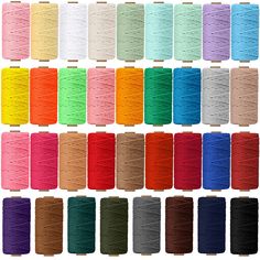 spools of thread in different colors and sizes on white background with clipping for text