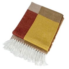 a multicolored blanket with fringes on it