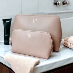 Beautiful faux leather makeup bags make the perfect gift for a bridesmaid proposal. Customise this bag with your choice of initials name. These makeup bags are perfect for taking away on weekend trips or on holiday keeping all your makeup neat and tidy. Our makeup bags are available in 4 different colours; Grey, Pink, Black/gold (black with gold zip), Black/Black (Black with Black zip), Lilac, Rose Gold, Coral and Oyster. Features - Saffiano faux leather - Available in 2 sizes - Available in 10 Luxury Cosmetic Bag For Personal Use, Elegant Cosmetic Bag With Removable Pouch For Personal Use, Elegant Cosmetic Bag With Removable Pouch, Elegant Personalized Bags For Gifts, Elegant Personalized Bags As Gifts, Personalized Bags For Bridesmaid Gift, Monogram Cosmetic Bag, Makeup Organiser, Large Pencil Case