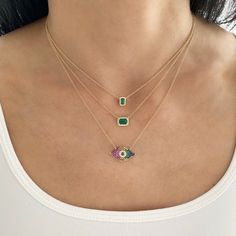 This beautiful dainty necklace features an emerald stone surrounded by diamonds. 14K Yellow Gold Stone measurement: Approx. 1/4" long Chain length: 14" + 1" + 1" Each stone may vary slightly in color Green 14k Gold Necklace With Diamond Accents, 14k Gold Green Necklace With Diamond Accents, Dainty Green Diamond Necklaces, Fine Jewelry Green Diamond Necklace In 14k Gold, Green Diamond Necklace In 14k Gold, Gold Eyes, Gold Stone, Emerald Stone, Evil Eye Necklace