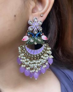 These beautiful Kundan earrings are the perfect accessory to brighten up your outfit. They are lightweight and high quality, and sure to become a staple in your jewellery collection.  Available in 3 beautiful colours: lilac purple, dark green and hot pink.  In case of any queries, please feel free to contact us. Happy shopping! Peacock Design Drop Earrings For Party, Peacock Design Dangle Earrings For Party, Party Peacock Design Dangle Earrings, Multicolor Peacock Design Earrings For Party, Party Jhumkas With Peacock Design, Party Chandbali Jhumkas With Peacock Design, Peacock Design Chandbali Jhumkas For Party, Party Peacock Design Chandbali Jhumkas, Peacock Design Dangle Chandelier Earrings