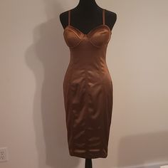 a dress on a mannequin in front of a white wall