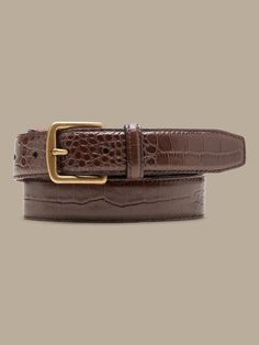 Sleek and streamlined, this embossed leather belt adds a bit of variety to your wardrobe.  LEATHER WORKING GROUP: By purchasing this product, you are supporting responsible leather manufacturing through the Leather Working Group.  Width: 1" (2. 5cm) Elegant Leather Belt With Crocodile Pattern, Luxury Brown Belts For Workwear, Luxury Fitted Belts With Belt Loops, Luxury Leather Belt With Crocodile Pattern, Classic Brown Belt Buckle For Office, Luxury Business Belt With Crocodile Pattern, Luxury Crocodile Pattern Belt For Business, Elegant Brown Belt Buckles For Formal Wear, Elegant Brown Belt Buckle For Workwear