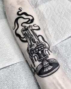 a man's arm with a tattoo on it that has an image of a machine