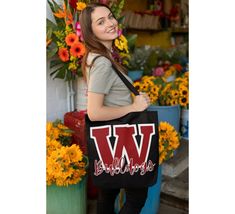 Show off your school or team spirit in style with our custom tote bags! These versatile and durable bags are perfect for carrying your books, gym clothes, or everyday essentials while proudly displaying your school or team colors. Whether you're a student, parent, or avid fan, these tote bags are a must-have accessory to show your support and enthusiasm. Versatile Use: Perfect for school, college, sporting events, tailgating, picnics, shopping, or everyday use. Available in 3 Sizes (See photos for size chart) Available in 20 different colors (See photos for color chart) *100% Polyester-Extremely strong and durable synthetic fabric that retains its shape and dries quickly  *Boxed corners *Black cotton handles *With non-woven laminate inside *Black inner stitching, transparent thread on hems Back To School Canvas Bag With Letter Print, School Canvas Bag With Letter Print, Back To School Bags With School Spirit, College School Spirit Bags For Back To School, Back To School Spirit College Bags, Black School Spirit Bag For College, Casual College Bags For End Of School Year, Casual Rectangular College Bag, Casual Rectangular College Bags