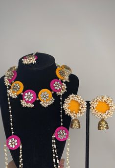 Elevate your look with our handmade jewelry set comes with necklace, earrings, tikka, and handchain ring. This exquisite piece blends the opulence of craftsmanship with the timeless elegance of pearls, perfect for adding a touch of regal beauty and sophistication to any haldi/gaye holud occasion. ✨ Mehendi Jewellery, Handmade Jewelry Set, Yellow Necklace, Hand Chain, Necklace Earrings, Necklace Set, Jewelry Set, Jewelry Sets, Timeless Elegance