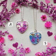 "Wear a piece of nature with one of these unique, handmade necklaces 🌿💜 ♡ Beautifully handcrafted with real flowers encased in resin with super sparkly glitter ✨ ♡ Each heart measures 2.5cm H x 2cm W  ♡ Attached to an 18\" Sterling silver chain,  ♡ Only 3 available - Red, Pink & Blue  ♡ Comes presented on a backing card with an Organza bag or the option of a lilac gift box for £1 extra - please see photos attached If you have any questions, please drop me a message 💜 Have a lovely day, Charlotte x" Valentine's Day Flower Pendant Necklace Keepsake, Silver Jewelry With Pressed Flowers For Mother's Day, Valentine's Day Keepsake Necklace With Flower Pendant, Heart Pendant Necklace With Pressed Flowers For Gift, Handmade Flower Pendant Keepsake Jewelry, Pressed Flowers Jewelry For Valentine's Day Gift, Heart-shaped Jewelry With Pressed Flowers For Valentine's Day, Handmade Round Pendant Necklace For Keepsake, Handmade Silver Heart Necklace For Wedding