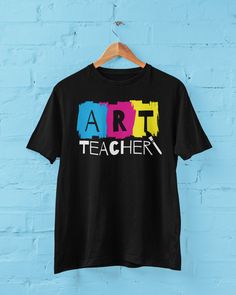 Art Teacher Tshirt, Art Teacher Shirt, Elementary Art Teacher Shirts, Art Teacher Appreciation Gift, Unisex Art Teacher T-shirt, CMYK Shirt.  You've now found the staple t-shirt of your wardrobe. It's made of 100% ring-spun cotton and is soft and comfy. The double stitching on the neckline and sleeves add more durability to what is sure to be a favorite!   * 100% ring-spun cotton * 4.5 oz/yd² (153 g/m²) * Pre-shrunk * Shoulder-to-shoulder taping * Quarter-turned to avoid crease down the center Artsy Cotton T-shirt With Graphic Print, Artsy Cotton T-shirt With Custom Print, Artistic Multicolor Crew Neck T-shirt, Artsy Black Crew Neck T-shirt, Cotton Art With Graphic Print For Artistic Expression, Artistic Cotton Art With Graphic Print, Artsy Crew Neck T-shirt With Graphic Design, Graphic Design Cotton T-shirt, Graphic Tee T-shirt For Artistic Expression With Custom Artwork