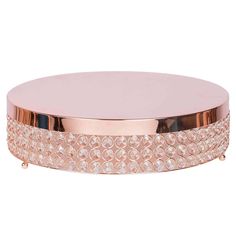 a round pink box with lots of diamonds on it