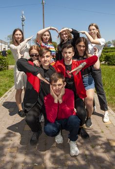 a group of young people standing next to each other