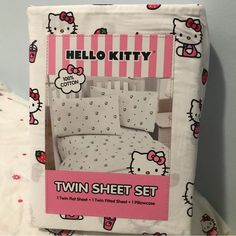 the hello kitty twin sheet set is pink and white