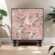 an image of a pink floral wallpaper with birds and flowers in the background on a wooden floor