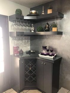 a corner bar with wine glasses on it