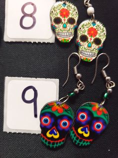 HANDMADE SUGAR SUGAR EARRINGS set 4 --choose from #1-9 and that exact one you will receive :) If you would like many please message us :) DETAIL IS AMAZING! NOT ONE IS THE SAME! COOLER IN PERSON! Set 4 Bohemian Skull Earrings For Gifts, Nickel Free Skull Jewelry For Day Of The Dead, Nickel-free Skull Jewelry For Day Of The Dead, Halloween Skull Jewelry With Skull Print, Multicolor Halloween Earrings For Gift, Multicolor Halloween Earrings Gift, Day Of The Dead Skull Jewelry Gift, Handmade Earrings For Day Of The Dead, Handmade Skull Earrings For Halloween