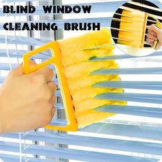 a hand holding a yellow window cleaning brush with the words blind window cleaning brush on it