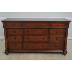 a large wooden dresser with many drawers