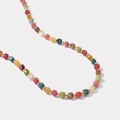 Embrace the vibrant energy of summer with our Colorful Seed Bead Necklace! This delightful piece features a playful mix of colorful natural stones, strung on a durable brass base plated in gleaming 18K gold. This bohemian-inspired necklace will add a touch of elegance to your style. Perfect for summer adventures or adding a pop of color to your holiday outfit. Find your perfect combination of natural stones and showcase your summer style! DETAILS Plating: 18K Gold Materials: 18K Gold on Brass, N Multicolor Faceted Beads Necklace For Summer, Summer Multicolor Faceted Beaded Necklaces, Bohemian Rainbow Crystal Necklaces With Faceted Beads, Bohemian Rainbow Crystal Necklace With Faceted Beads, Multicolor Faceted Beads Jewelry For Beach, Multicolor Round Bead Crystal Necklaces For Beach, Multicolor Beaded Necklaces With Natural Stones For Beach, Multicolor Gemstone Beads Necklaces For The Beach, Summer Multicolor Beaded Necklaces With Natural Stones