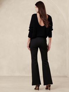 This flare-leg pant is designed for comfort, cut from our Everywhere Ponte fabric.   We developed this special Ponte de Roma, enhancing its softness with special stretch fibers that create a smooth, supportive fit that always looks polished.   4-way Stretch Flare Fit: High-rise (10").  Slim through the hip and thigh with a flared leg.  Full length.  Sustainability: Made with Birla Livaeco™ viscose, a fiber derived from renewable wood resources and sourced from responsibly managed forests.  Birla Livaeco™ viscose is manufactured using a stringent closed-loop process that significantly reduces carbon emissions and water consumption as compared to generic viscose.  Pull-on design with concealed elastic at the waist.  No pockets.  Pin-tuck stitch detail creates the look of a trouser crease.  U Flare Black Pants, Spain Trip, High Waisted Cropped Jeans, Slim Fit Tuxedo, Ponte Fabric, Water Consumption, Ponte Pants, Black Flare, Flare Leg Pants