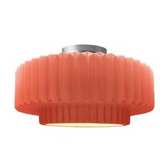 an orange light fixture on a white background