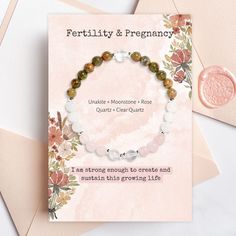 Meticulously crafted, this bracelet combines the gentle energies of Rose Quartz, Clear Quartz, Unakite, and Moonstone crystals, offering you unparalleled support and nurturing vibrations throughout this miraculous chapter of your life.Revered for its remarkable ability to promote a healthy pregnancy, Unakite harmonizes your body, fostering a state of calmness and centeredness as you embrace each stage of your journey. Its loving energy envelops you, providing a gentle, nurturing embrace that sup Spiritual Beaded Birthstone Bracelets, Holistic Rose Quartz Jewelry For Healing, Healing Rose Quartz Jewelry, Healing Hand-strung Rose Quartz Jewelry, Spiritual Birthstone Bracelets For Mother's Day, Adjustable Spiritual Rosary Bracelet For Mother's Day, Healing Crystal Bracelet With Birthstone, Spiritual Natural Stones Jewelry For Mother's Day, Spiritual Healing Crystal Bracelet With Birthstone