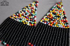 These black and colorful beaded earrings are made of high-quality Czech beads and strong synthetic thread. They are elegant, fashionable, and highly versatile, suitable for everyday wear. Features: Sterling silver components Color: black, colorful mix Length (approximate): 7.5 cm (2.95 in) This item is currently in stock. More beaded earrings http://etsy.me/2ycItdb Gerdan necklaces http://etsy.me/2mihf0J Beaded necklaces http://etsy.me/2Dkf1Fo Crochet necklaces http://etsy.me/2CAPdFc Back to sho Black Beaded Drop Earrings With Large Beads, Black Large Beaded Drop Earrings, Handmade Multicolor Beaded Earrings For Party, Colorful Dangling Beads Earrings For Party, Colorful Beaded Dangling Earrings For Party, Black Earrings With Large Round Beads, Colorful Beaded Chandelier Earrings For Party, Black Large Beaded Dangle, Festival Black Beaded Chandelier Earrings