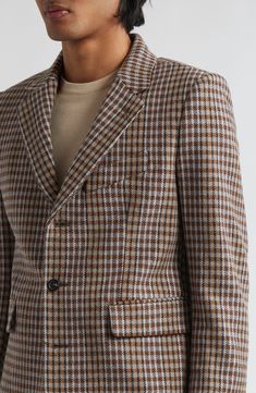 The silhouette of this dapper blazer is a reproduction of a midcentury jacket and is made from herringbone-woven merino-wool tweed to enhance the retro vibe. Three-button closure Notched lapels Four-button cuffs Chest welt pocket; front flap pockets Back vents 100% merino wool Dry clean Made in France Designer Clothing