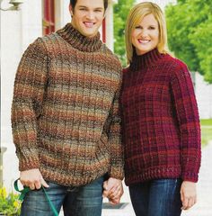 a man and woman holding hands while standing next to each other in front of a building